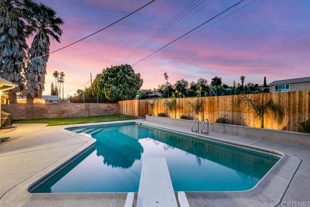 It is situated on a large 8131 sq ft lot and features a great pool in the back yard.