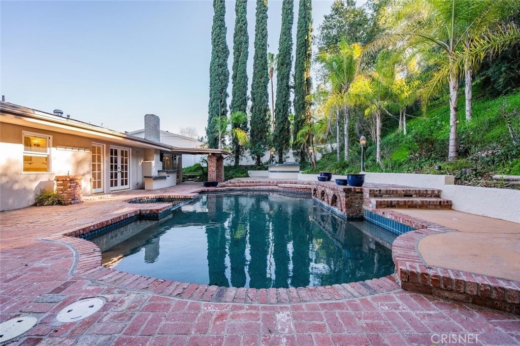 Single-Story Pool Home with resort-style backyard